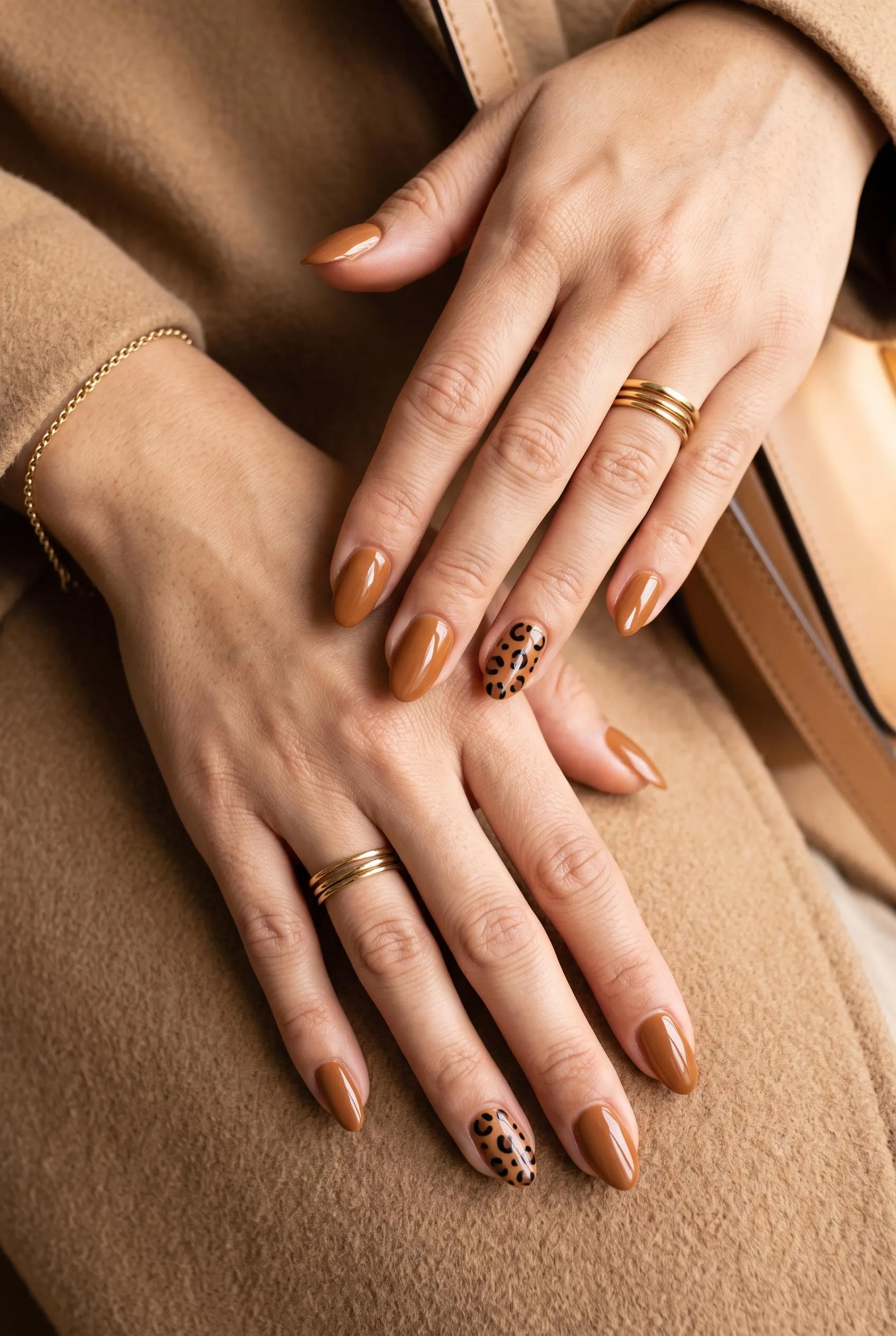 Caramel brown almond nails with black leopard print accent nails