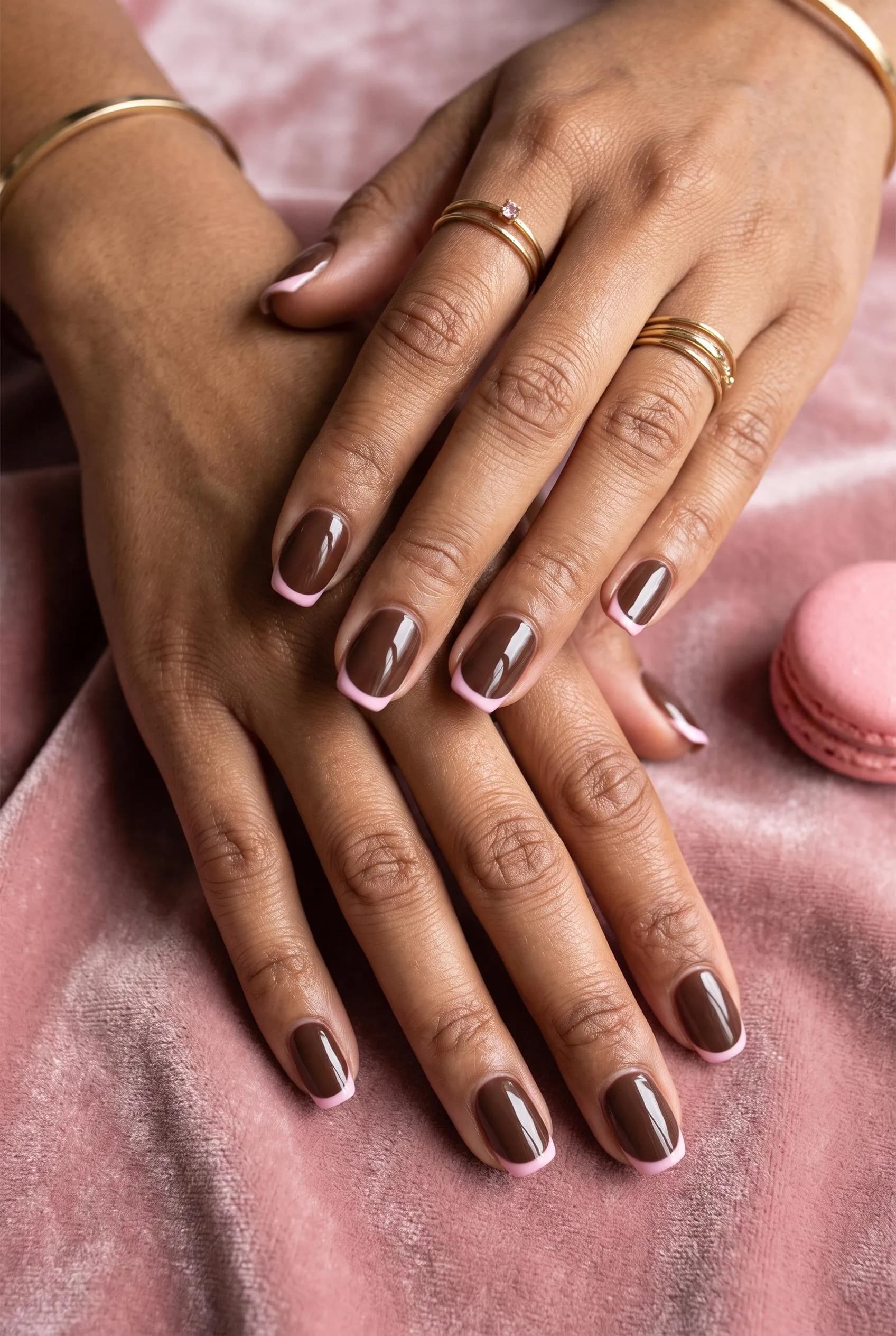 Glossy chocolate squoval nails with thin baby pink French tips