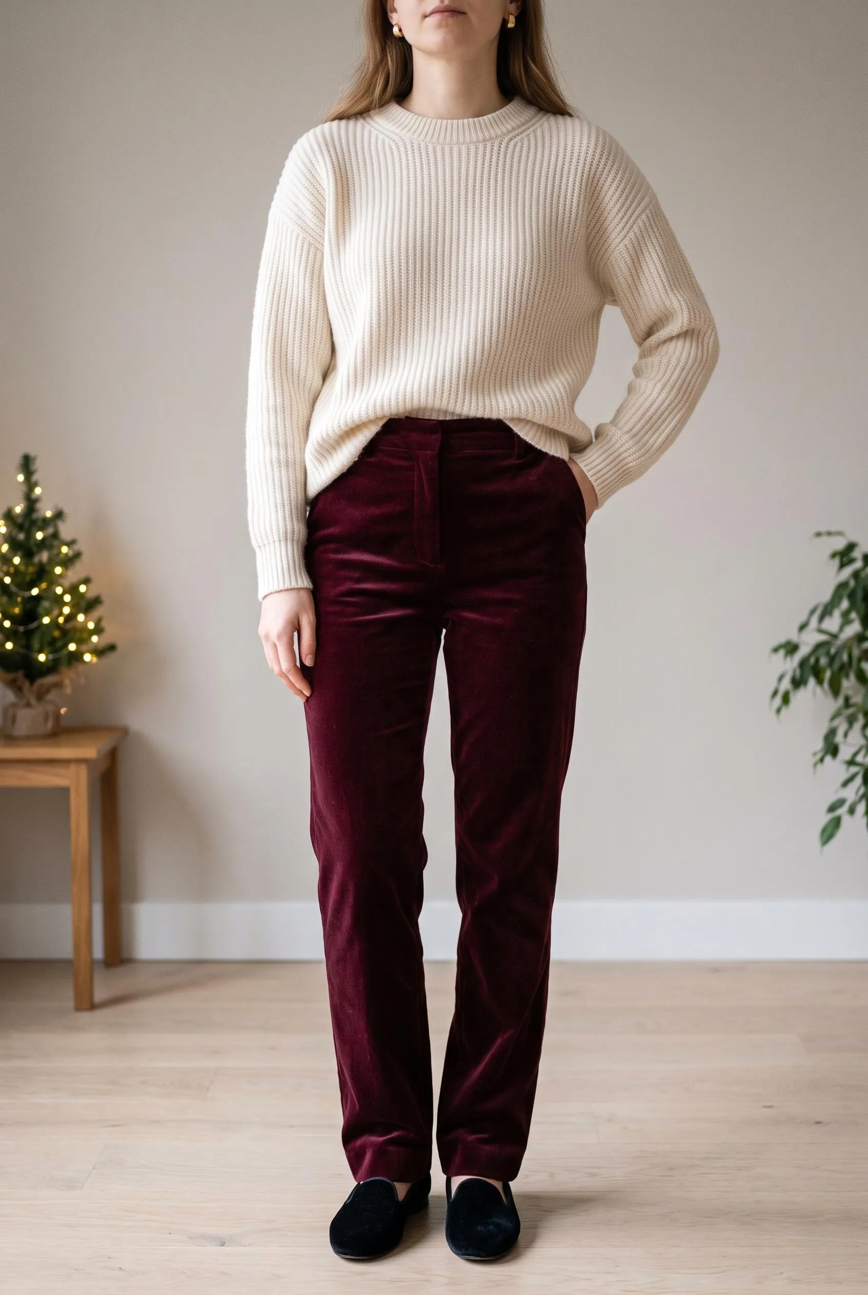 Cream ribbed knit sweater with burgundy velvet trousers and black velvet slippers