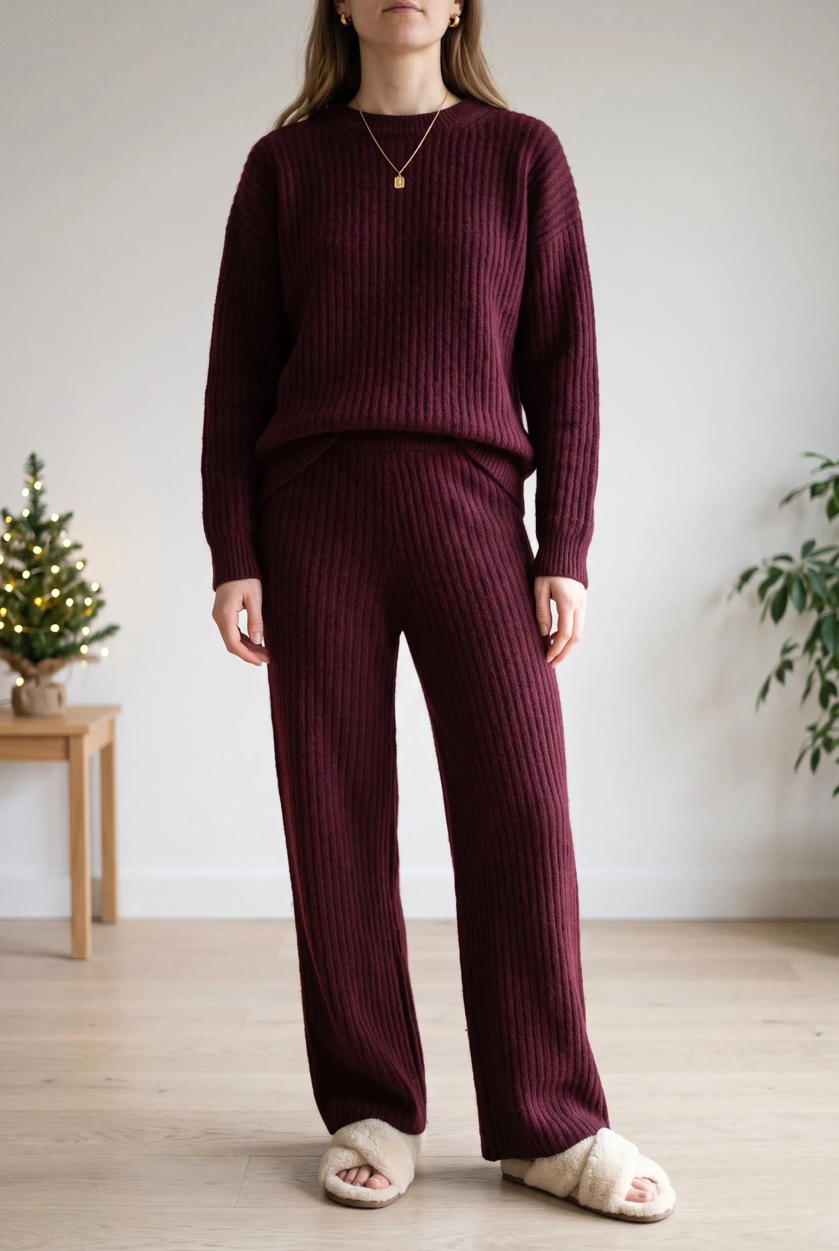 Matching burgundy ribbed knit sweater and wide-leg trousers with cream slippers