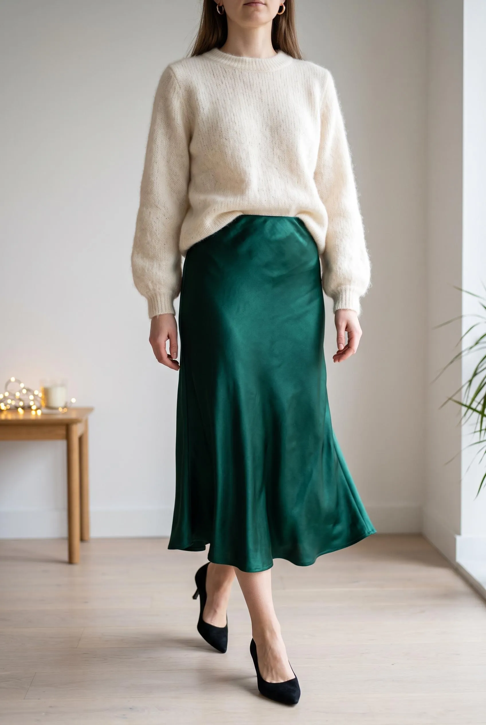 Emerald satin slip skirt with a fluffy cream sweater and black kitten heels