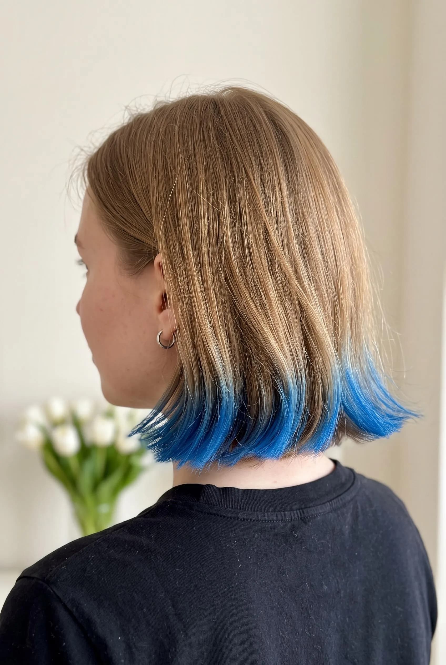 Light brown jaw-length bob with the ends dipped in electric blue