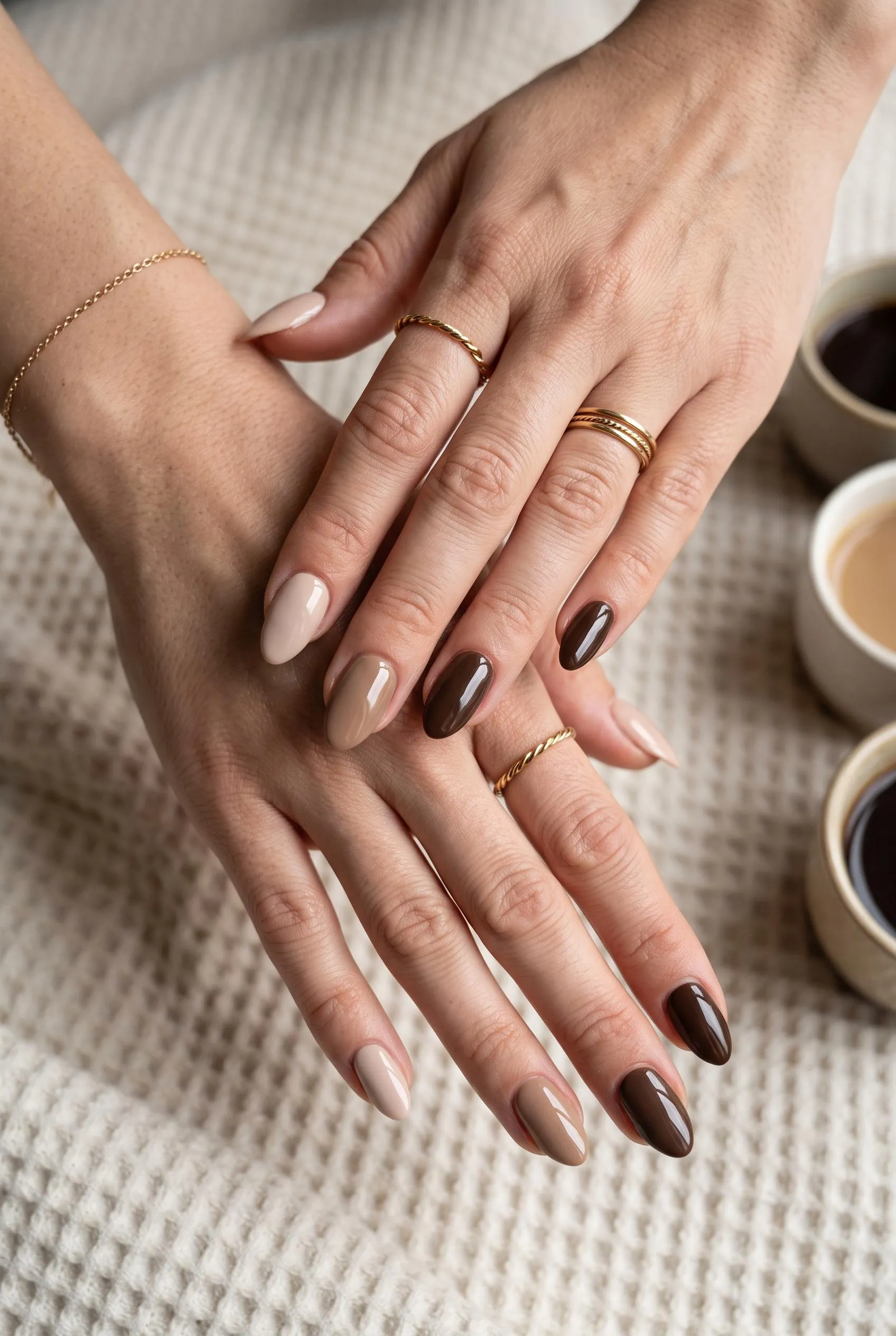 Mocha almond nails with a soft brown magnetic cat eye shimmer on brown velvet